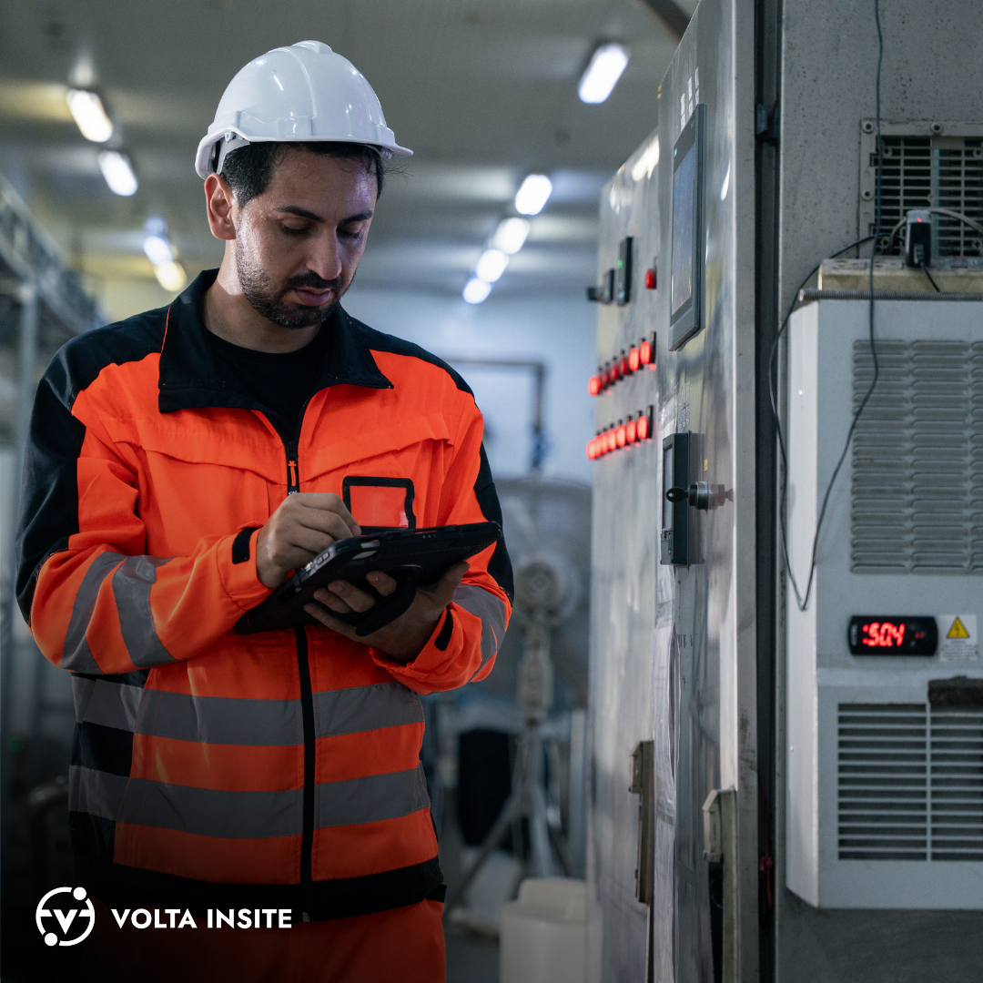 Technician using tablet to review predictive maintenance dashboard