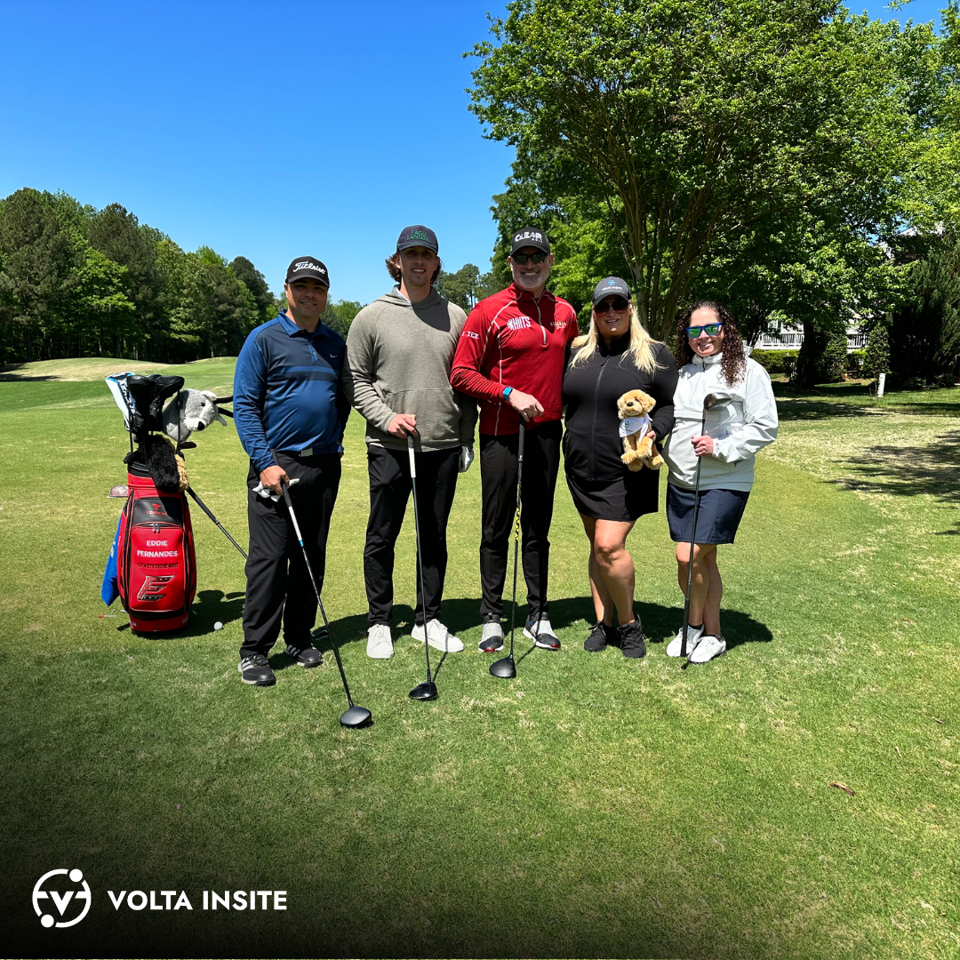Lauren Hilton and Maxwell with golfers at the 2024 AFCOM NC 4th Annual Golf Outing
